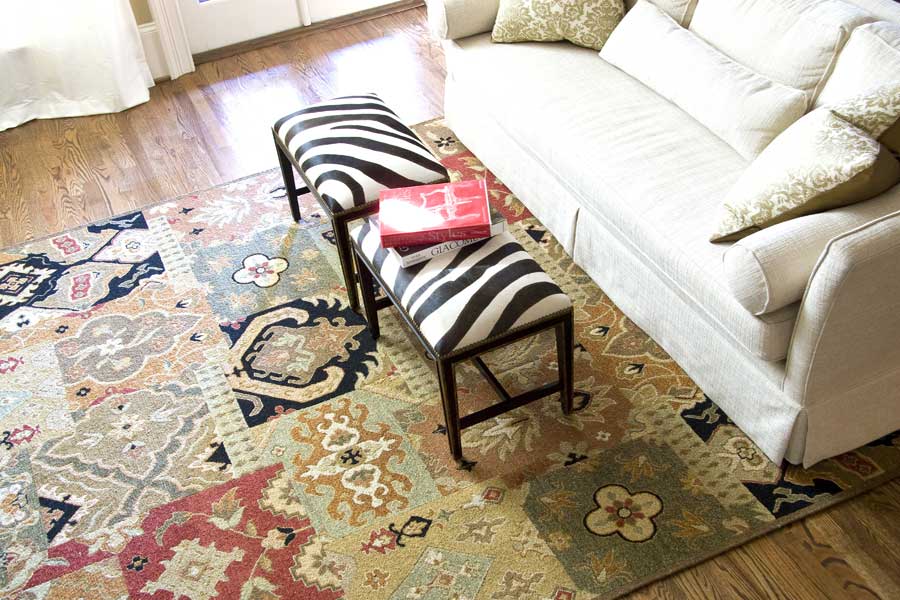 custom size rug with a tribal design in a living room