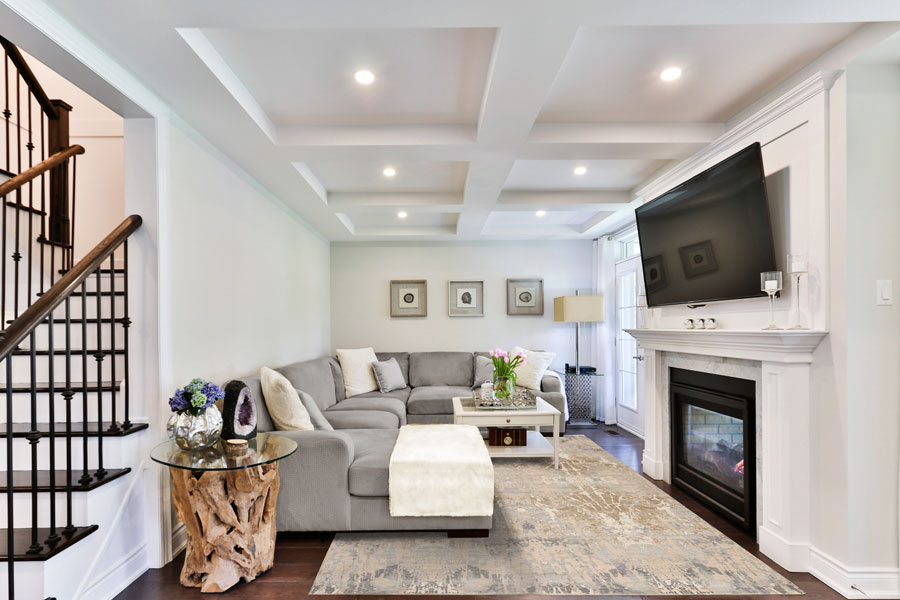 a pastel rug covers the floor of a living room