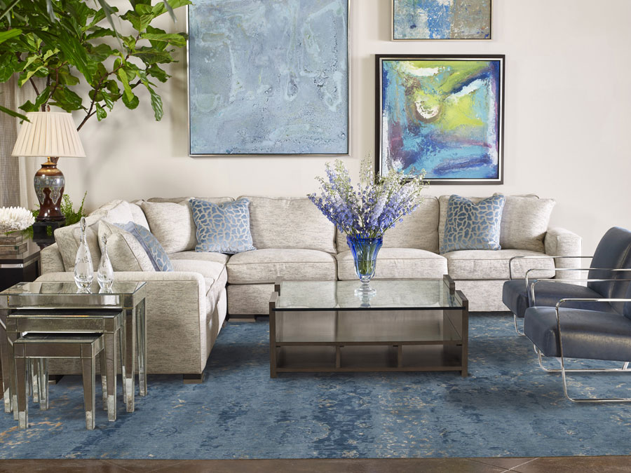 a blue area rug placed in the living room