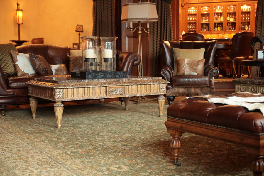 a large vintage rug inside a classic-style living room