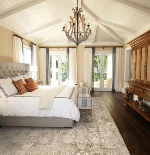 hardwood floor and neutral rug for bedroom