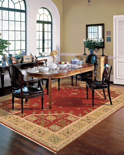 red and yellow tribal rug in the dining room