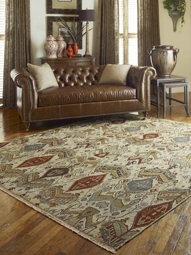 a wooden floor adorned with a tribal area rug