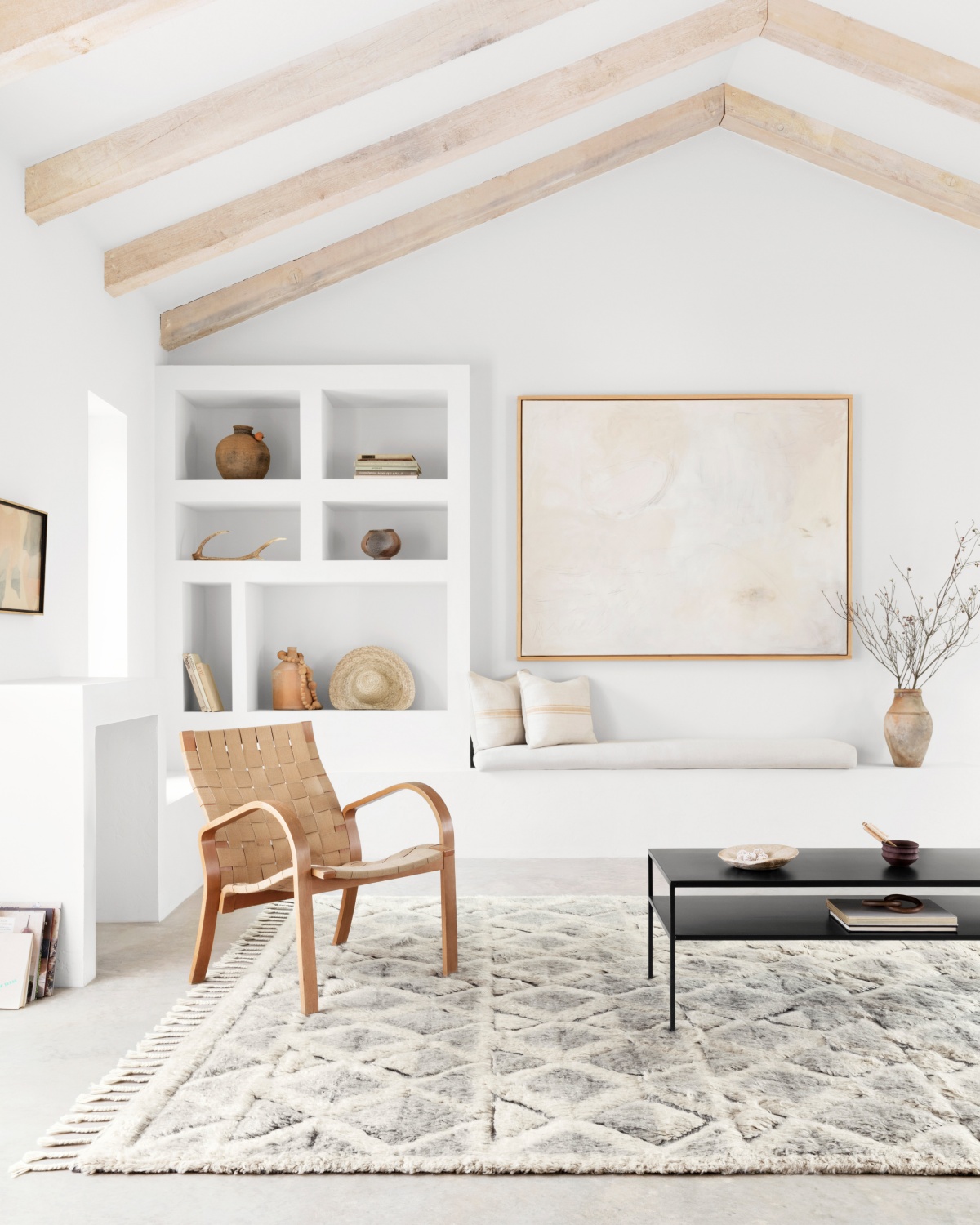 white room vaulted ceiling with brown accents