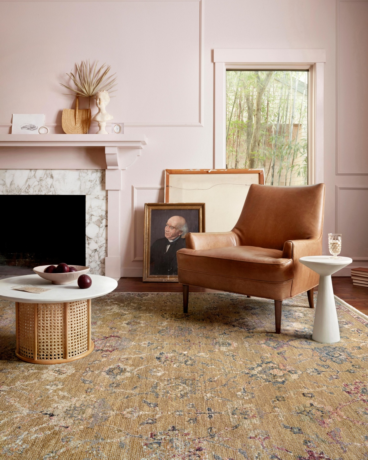 pink living room with a brown rug