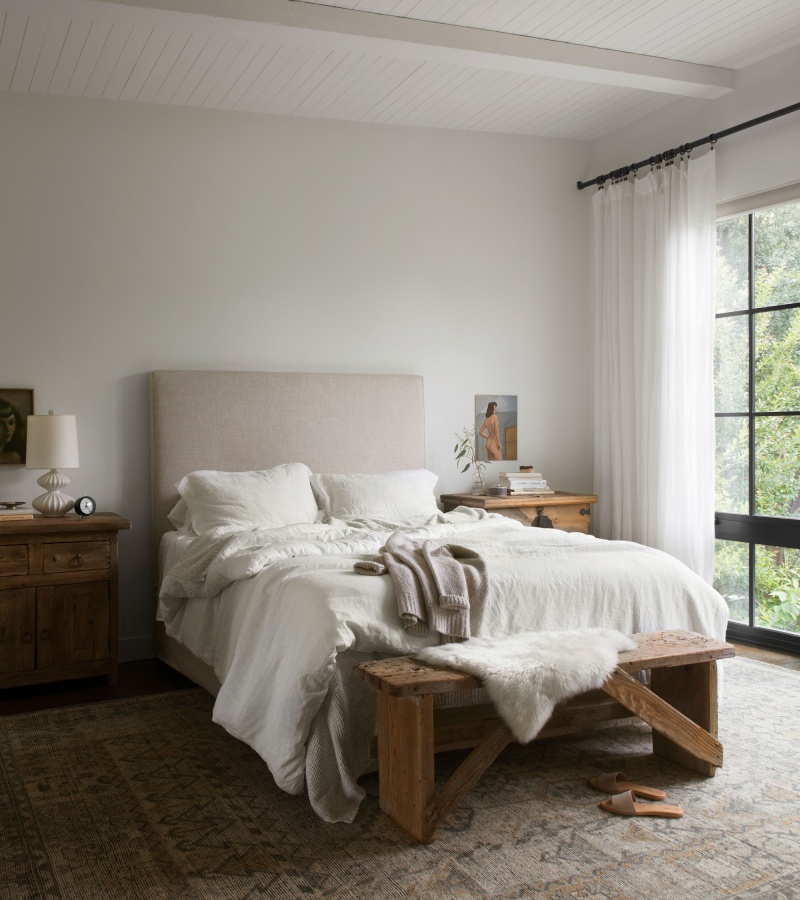 boho inspired bedroom with vintage side tables/dressers