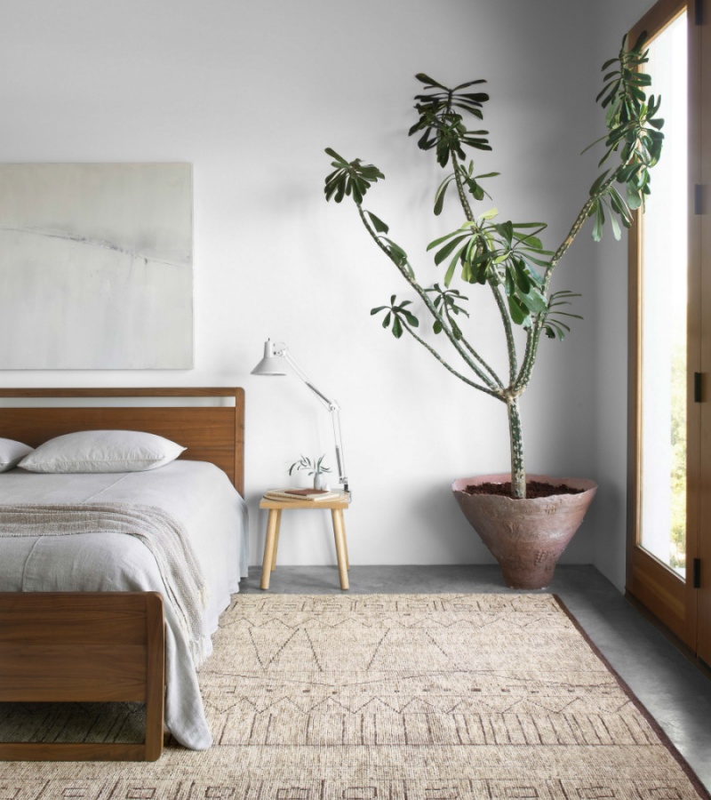 boho-inspired bedroom with a textured brown rug