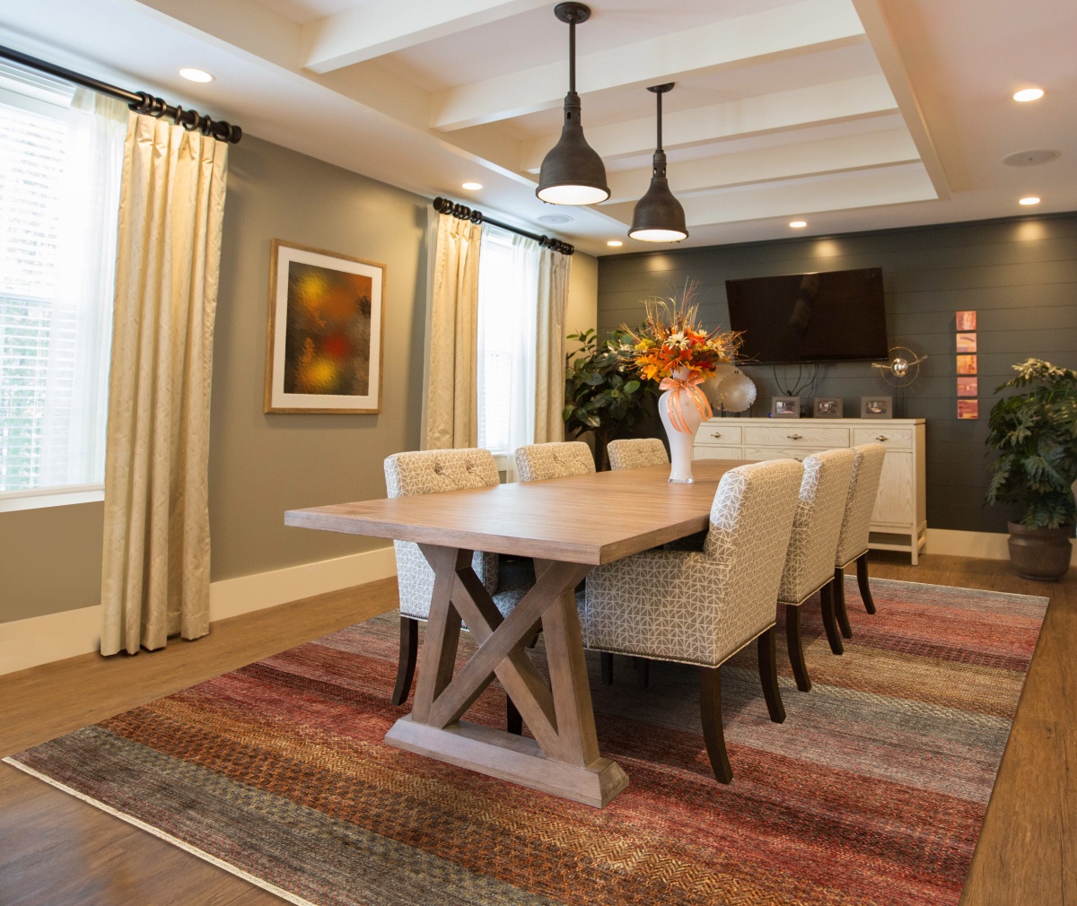 transitional dining room with a rug