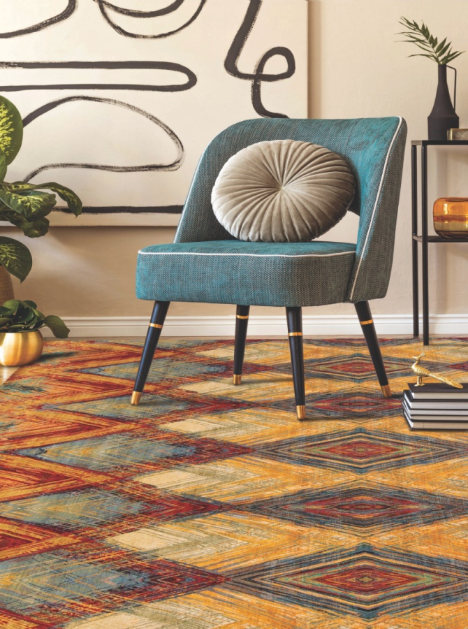 multicolor rug and blue sofa 