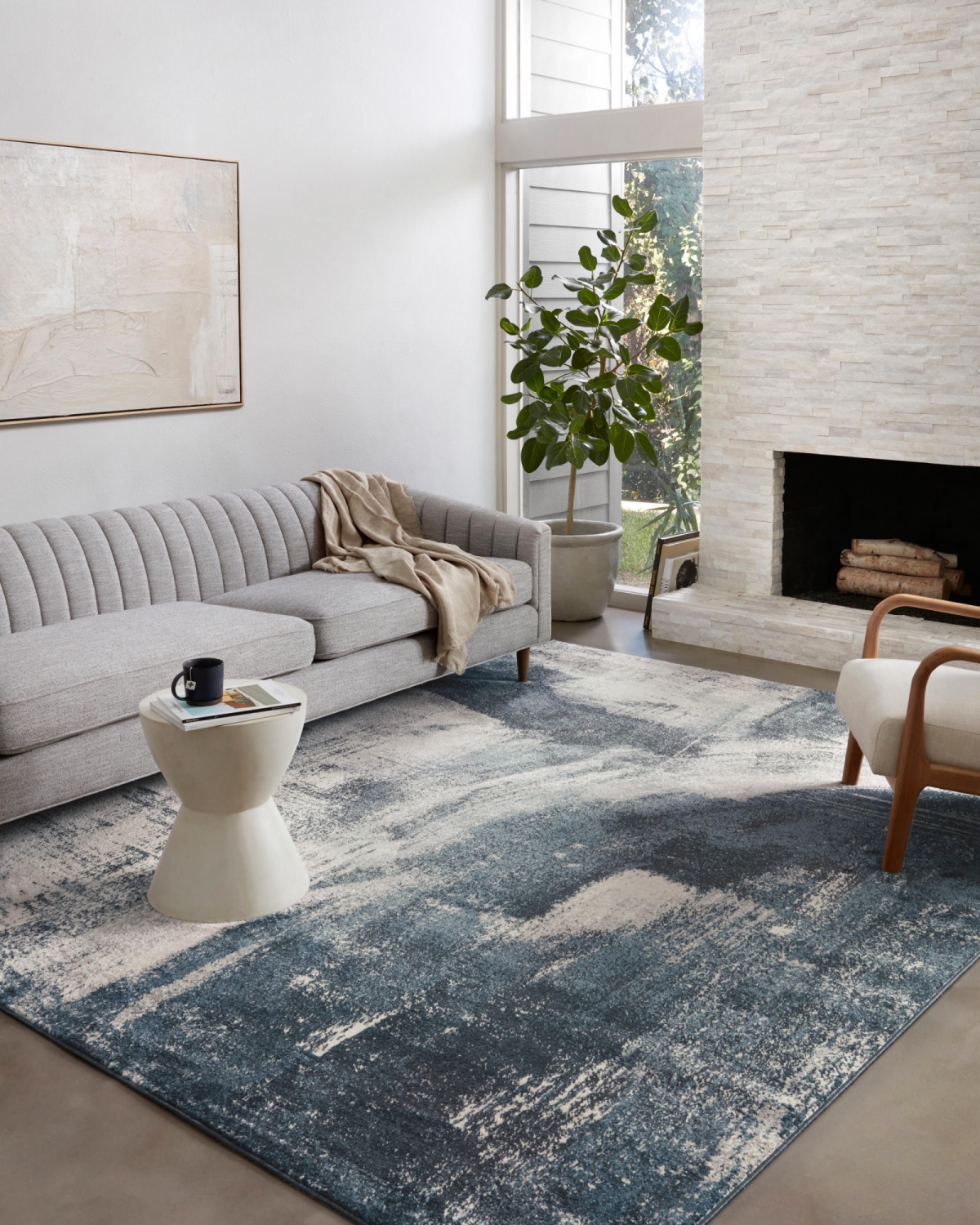 coastal-themed living room with a blue rug