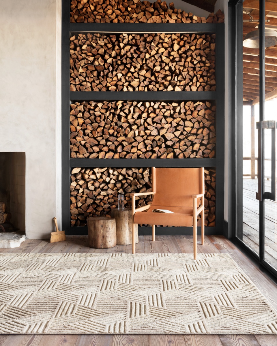 coastal fireplace area with a brown rug