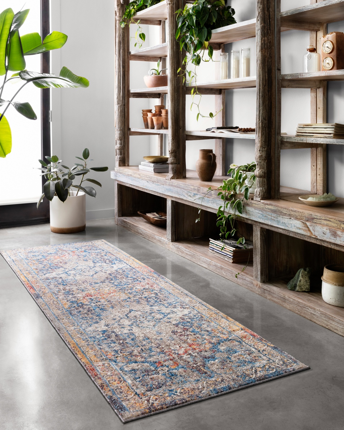 Wabi-sabi shelf with plants and ceramics