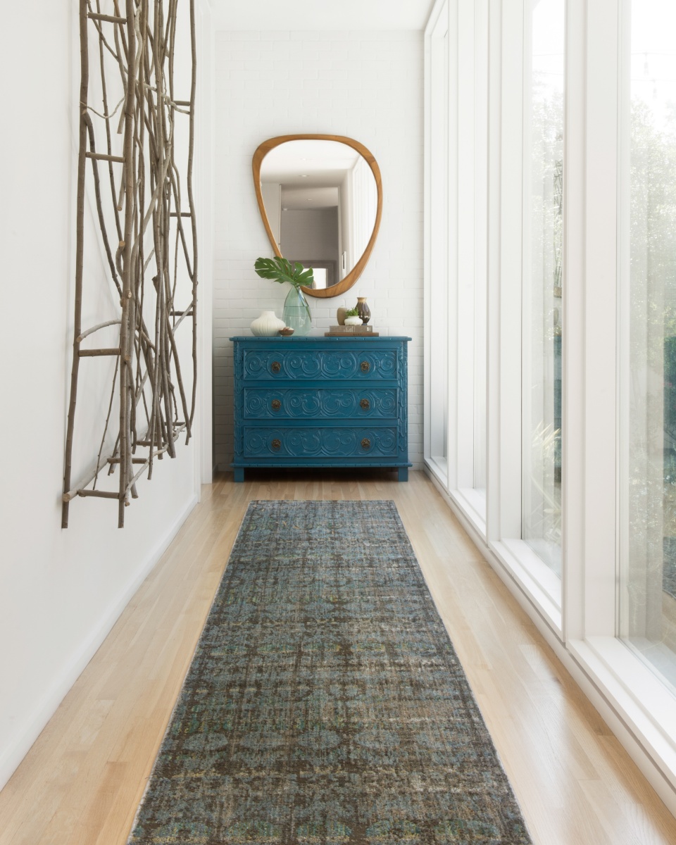 Hallway design with huge mirror and runner rug