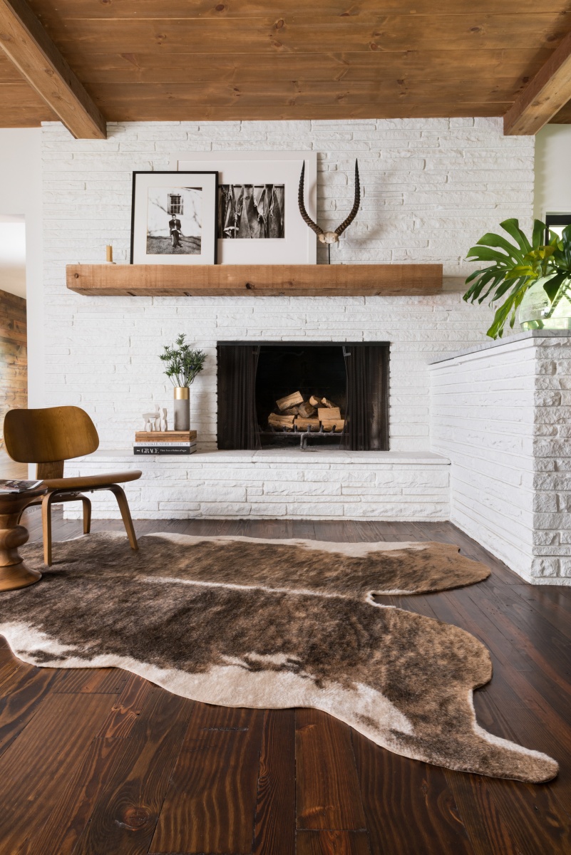 scandinavian-inspired fireplace with dark wood 